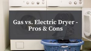 gas vs electric dryer sitting side by side with laundry basket in front.